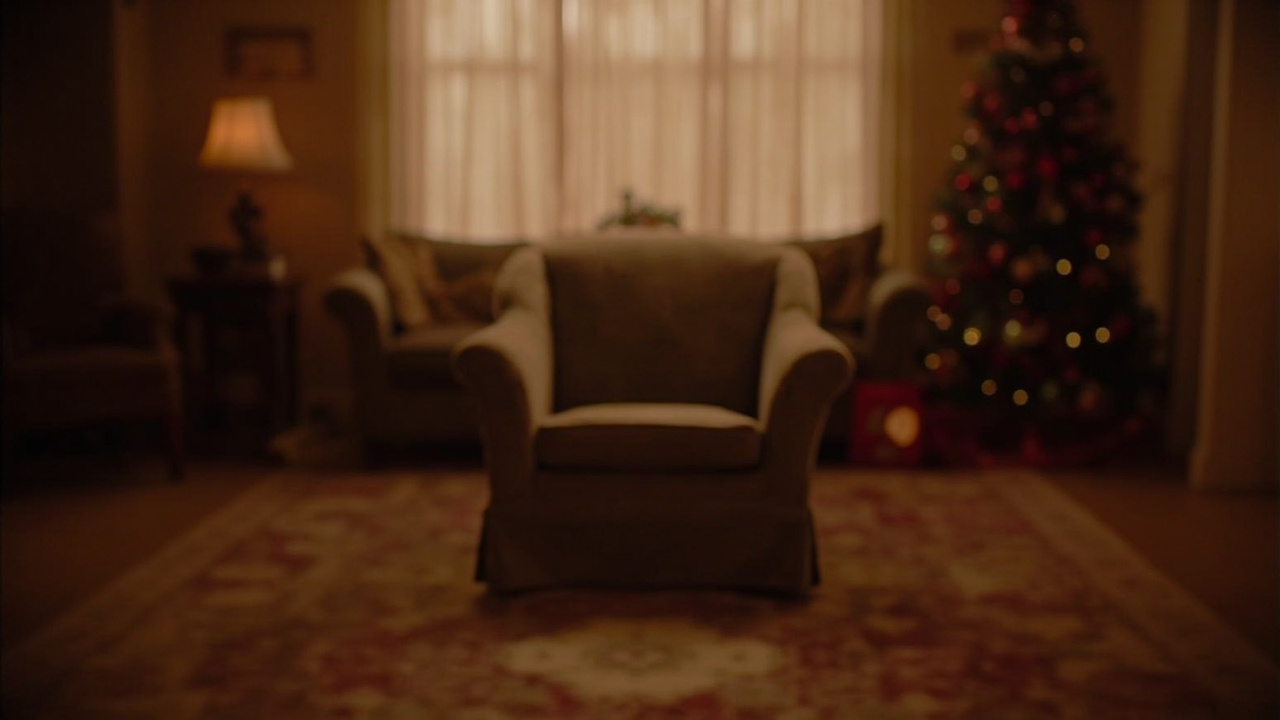 A warmly lit living room set from a television studio, empty armchair center frame, soft focus Christmas decorations in the background