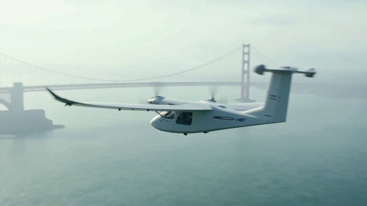 A sleek white electric aircraft with tilted rotors flying low over a bay, the Golden Gate Bridge visible in the hazy background