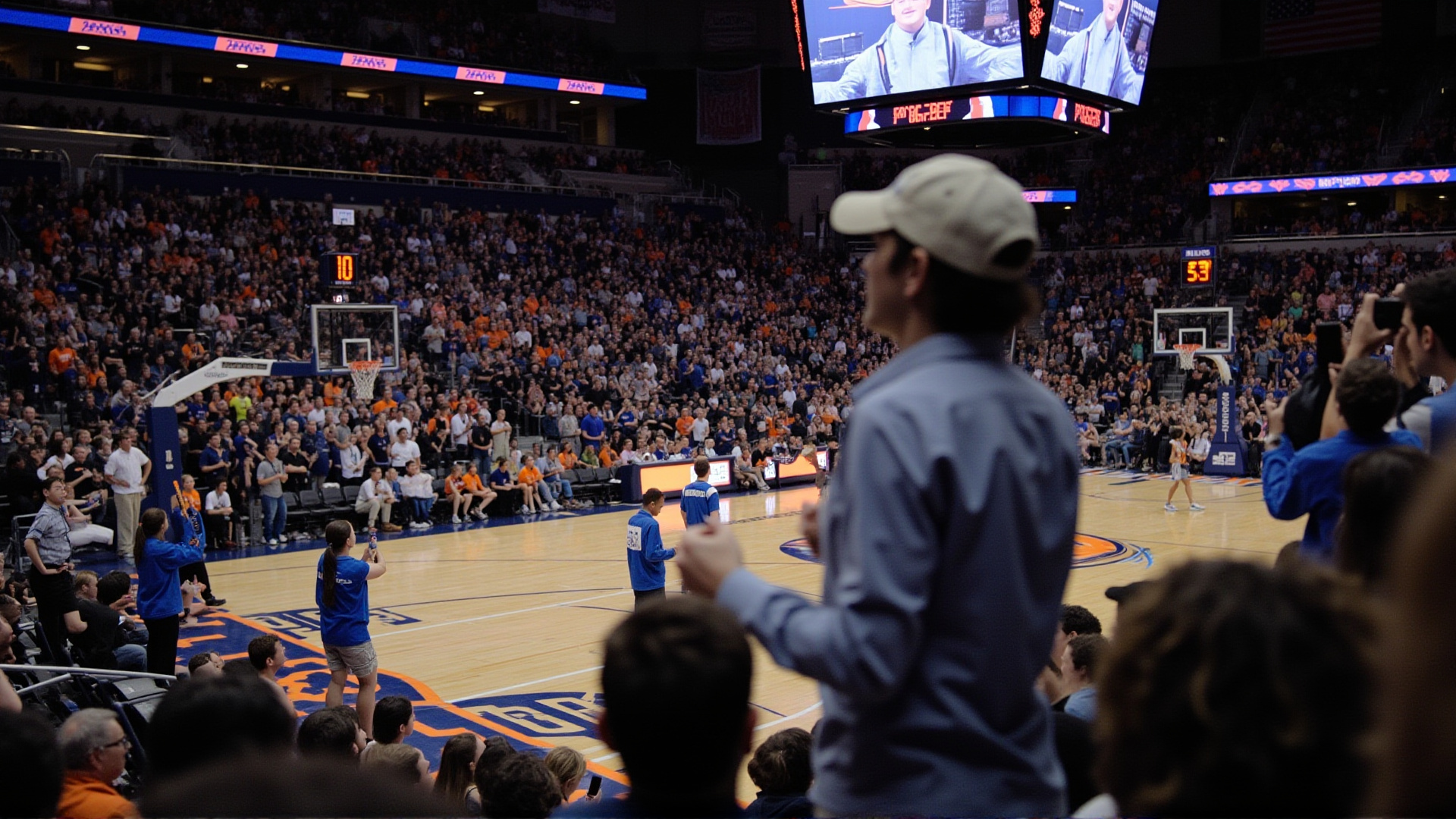 A packed college basketball arena, students in the stands holding signs, court-level view, intense game atmosphere, blue and orange team colors