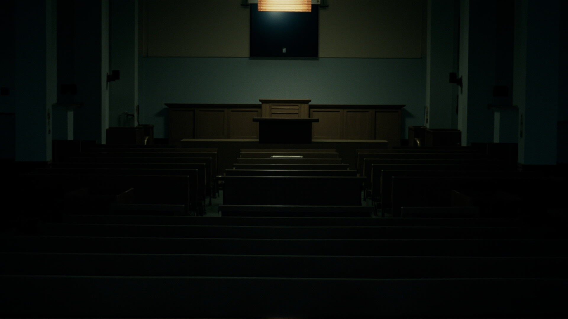 A medical school lecture hall, empty seats in rows, a single spotlight on the podium, institutional architecture, serious atmosphere