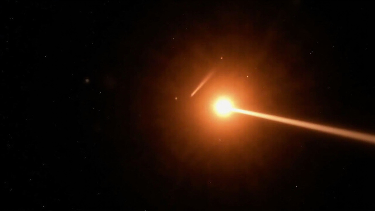 Solar corona with bright streaking comet trail approaching the sun, space telescope view