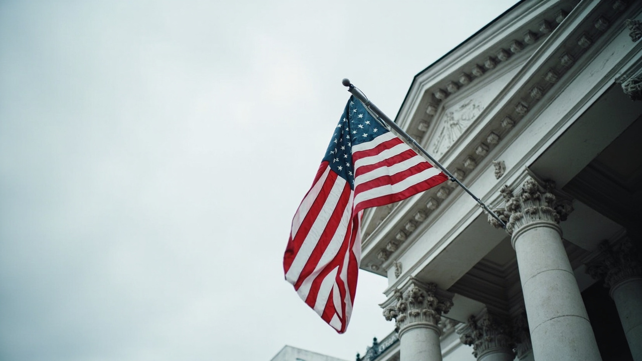 An American flag hanging limply from a government building flagpole against a grey overcast sky