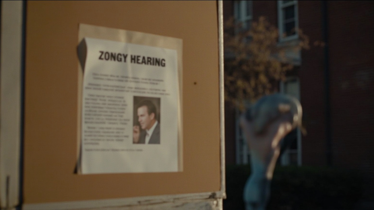 Virginia county courthouse exterior with a zoning hearing notice taped to a bulletin board, early morning light