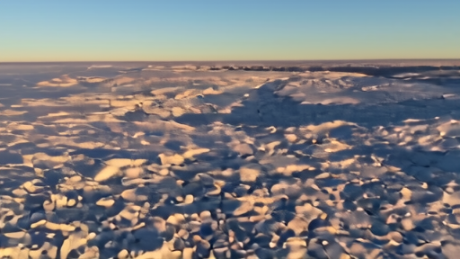 Overhead satellite-style view of the Amundsen Sea coastline with Thwaites glacier tongue visible, fractures in ice.