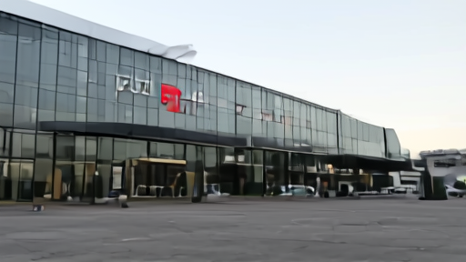 Exterior of Netflix corporate headquarters in Los Gatos, California in early morning light, the red N signage visible on the facade, no pedestrians.