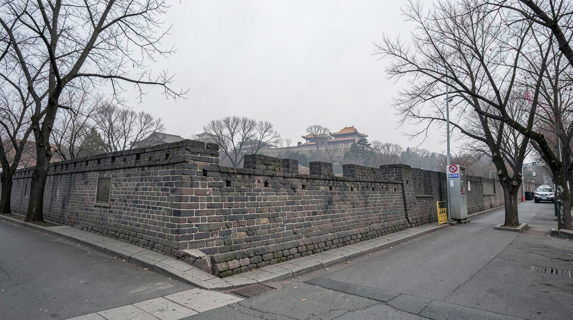 Exterior of Zhongnanhai compound in Beijing Monday afternoon with a security checkpoint visible, overcast sky