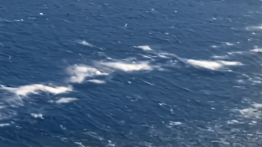 A clean weather-satellite-style visualization of the Northern Hemisphere winter jet stream on a Wednesday morning with the Pacific jet shown as a straight zonal ribbon and the Atlantic jet visibly tilted northeast across the ocean basin.