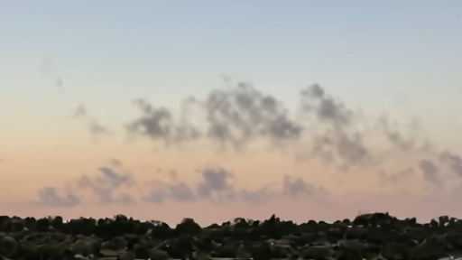 Smoke above a south Lebanon ridge with UN vehicle below