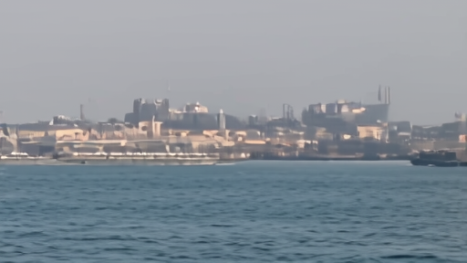 Kharg storage tanks and anchored tankers viewed from offshore