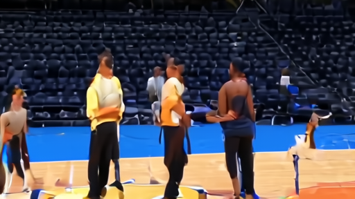 Crypto.com Arena practice court Saturday morning, three Lakers staff at the scorer's table, Doncic and Reaves in warm-ups on the sideline.
