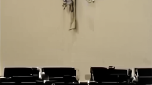 Empty bishops conference room with an agenda and crucifix