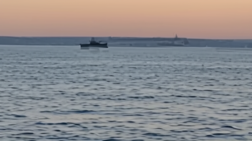 An empty supertanker silhouetted against a Gulf horizon at dawn, gauges showing low readings