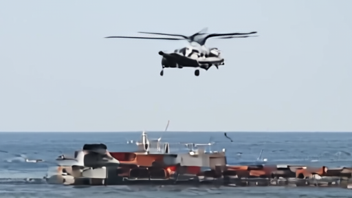U.S. Marines fast-roping from a helicopter onto a merchant ship's deck at sea.