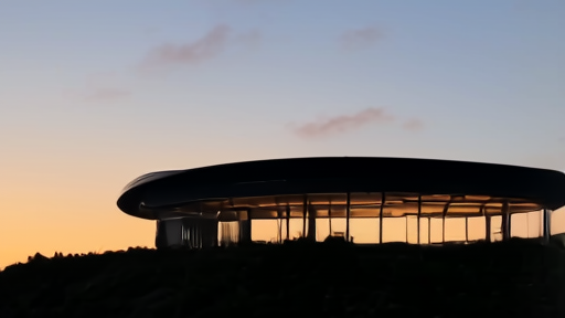 The Apple Park ring at dusk in Cupertino with the Steve Jobs Theater visible on the rise