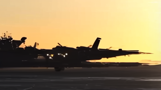 F-35Bs lined on USS Tripoli's flight deck under Arabian Sea sunset.