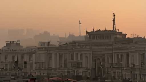 Tehran's diplomatic district at sunset with the Iranian flag against late-spring haze.