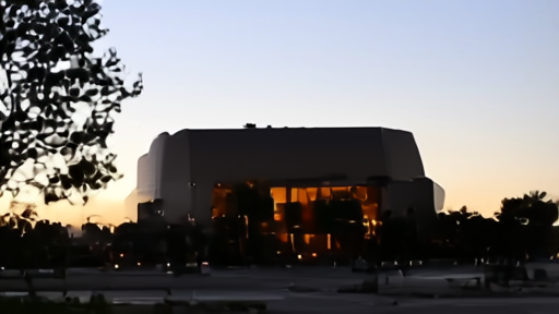 An empty Apple Park rotunda at dusk, the white spaceship building visible through trees, no banners, no signage about AI.