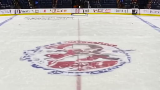 Ball Arena pregame ice with the Stanley Cup Playoffs second-round logo at center as a Zamboni completes a final pass.