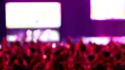 Olivia Rodrigo at a microphone during her SNL hosting episode dressed in stage clothing, studio lighting visible in foreground.