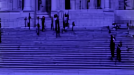 The federal courthouse in DC with photographers waiting on the steps at dawn.