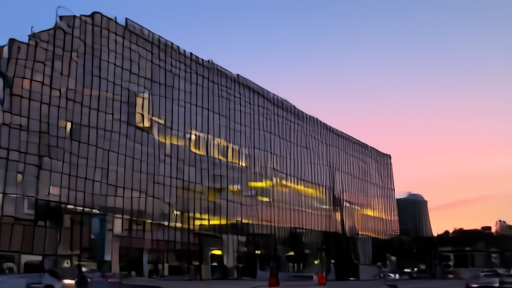 Disney Burbank tower at twilight with an ABC News van parked at the entrance
