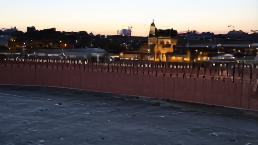 Aerial view of the Kremlin at dusk with a single window lit on the upper floor of the Senate building