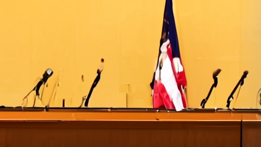 Two Gulf-state and U.S. officials enter a Miami hotel conference room past a podium with empty microphones and a folded national flag display.