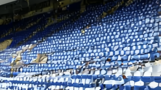 The London Stadium claret-and-blue seats partly empty after final whistle, a single matchday programme blowing across the concourse.