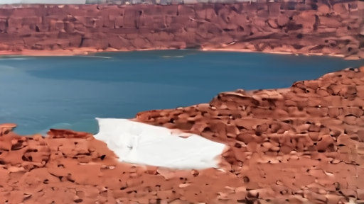 Lake Powell bathtub ring exposed on red sandstone canyon walls with low water levels.