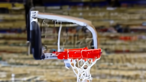 A broadcast camera pointed at a basketball rim after a missed three-pointer during a WNBA warmup.