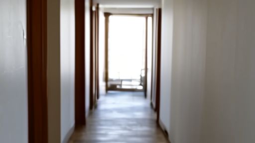 A gloved public-health worker checking a digital thermometer in a hotel corridor.