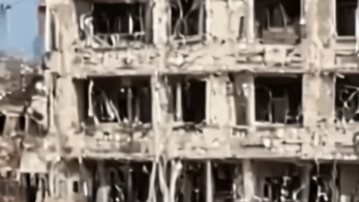 Damaged residential building in southern Lebanon with daily life visible in the foreground
