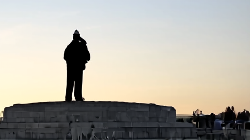 Tomb of the Unknown Soldier sentinel mid-stride in the 21-step walk, dawn light, no spectators visible.