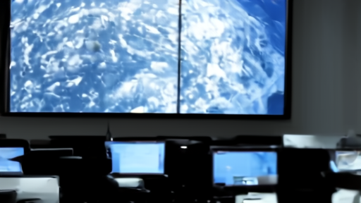 The NHC operations center in Miami with forecasters at consoles and a large Atlantic satellite image on a wall screen.