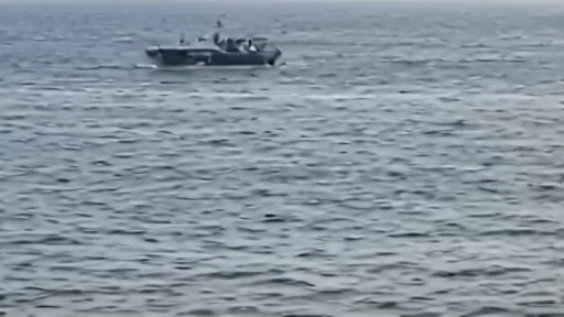 Oman coast guard vessel near a Strait of Hormuz lane marker