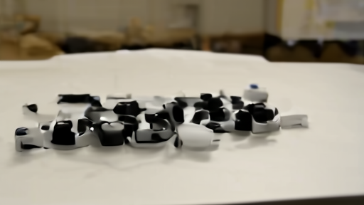 Robotaxi prototype in a test garage with sensor housings on a workbench