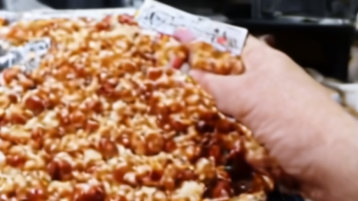 A frozen pizza box turned over so a shopper can check the UPC and sell-by date