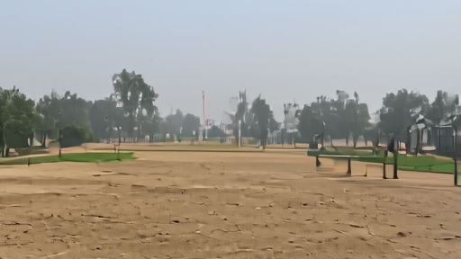 Family checking an AQI app at a hazy playground