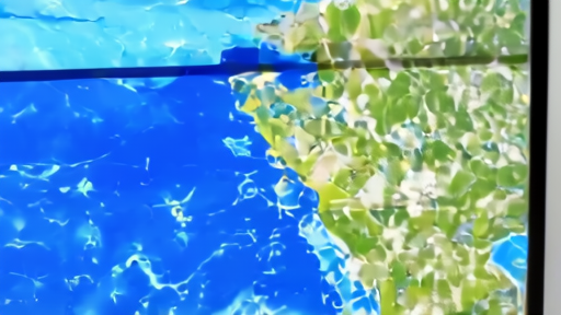 Coastal weather office monitor showing ocean storm tracks while forecasters review maps