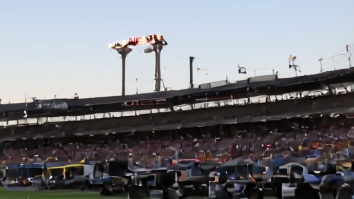 Rose Bowl stadium at late afternoon with broadcast trucks outside