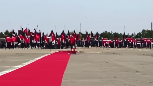 Xi Jinping stepping off the Air China plane at Pyongyang Sunan International Airport with DPRK honor guard