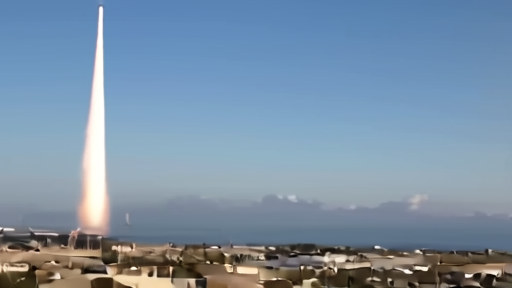 A rocket launching from a coastal pad with a long flame trail against a blue sky, viewed from a distance