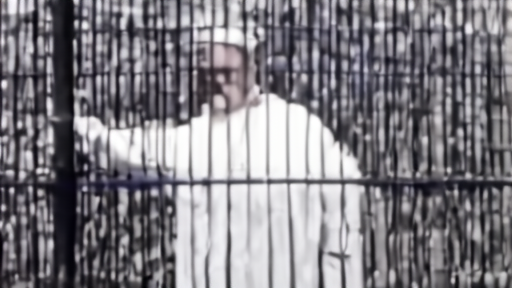 Pope Leo XIV greeting inmates through a fence at a prison facility