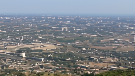A hillside view of Guadalajara's stadium district near roads, urban blocks and La Primavera