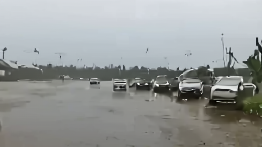 A Gulf Coast street floods near a high-tide shoreline before any named storm
