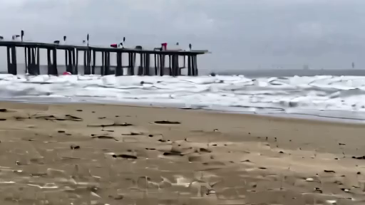 A North Carolina beach access point with red flags and rough surf