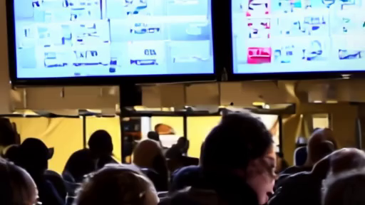 Packed sports bar watching a United States soccer match while a producer monitors ratings dashboards