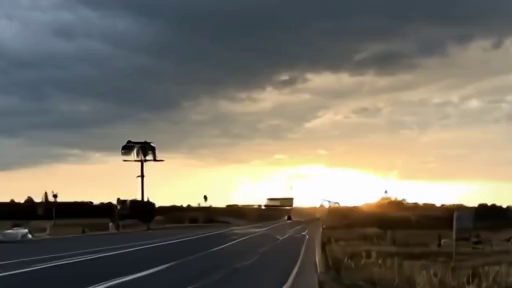 Highway rest stop under dark Plains storm clouds with travelers checking radar